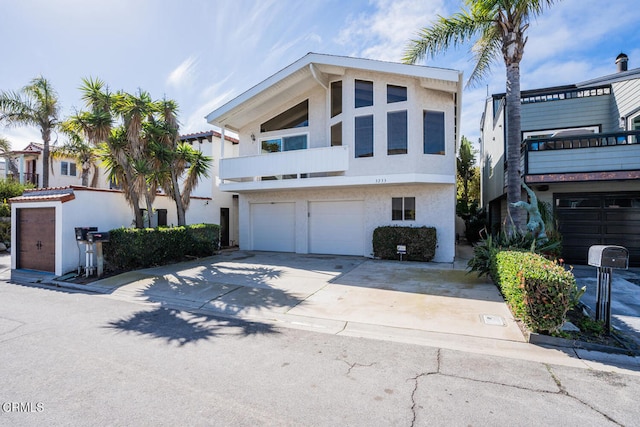 view of front of property with a balcony and a garage