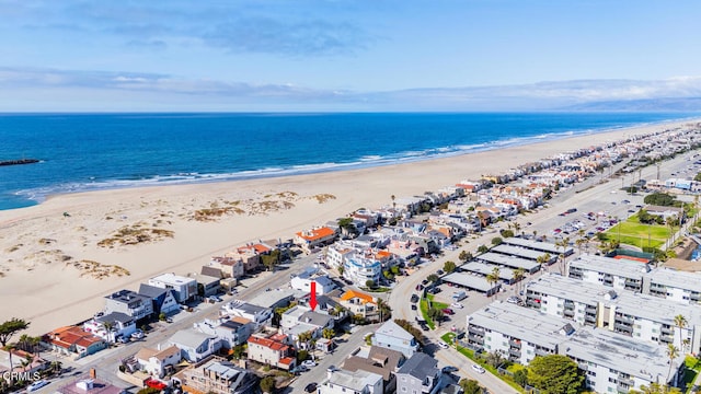 aerial view featuring a water view and a view of the beach