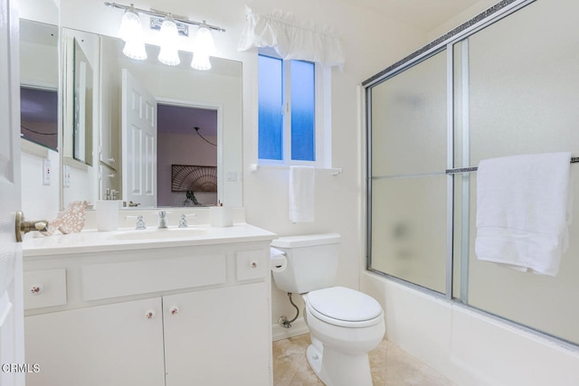 full bathroom with tile patterned flooring, vanity, shower / bath combination with glass door, and toilet