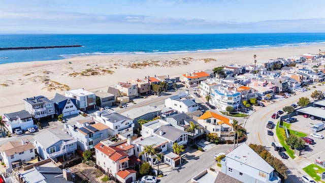 aerial view with a beach view and a water view