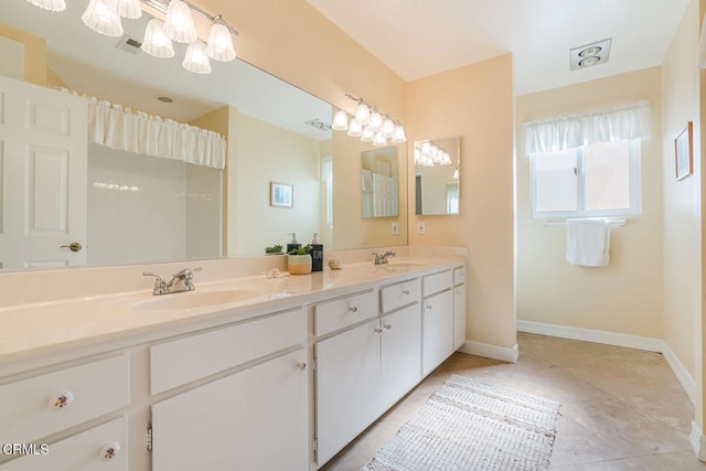 bathroom featuring vanity and tile patterned flooring