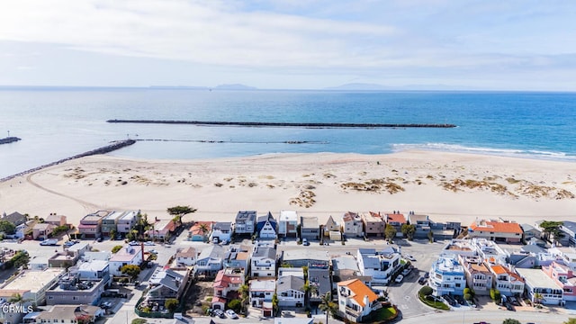 aerial view featuring a view of the beach and a water view