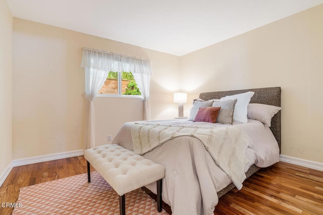 bedroom with hardwood / wood-style floors