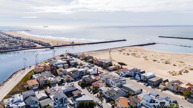 bird's eye view featuring a beach view and a water view