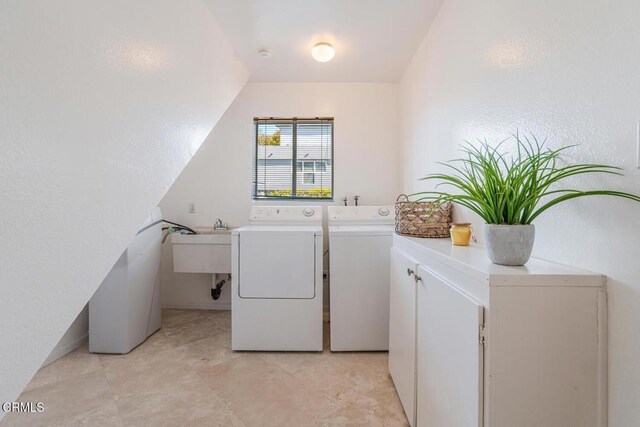 3233 Playa Ct, Oxnard, CA 93035 - washroom featuring independent washer and dryer and cabinet space