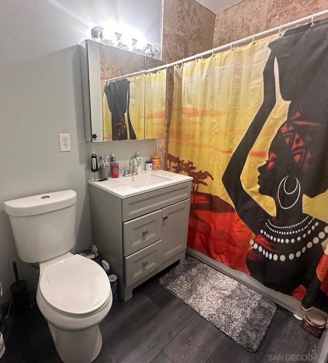 bathroom with vanity, hardwood / wood-style flooring, toilet, and a shower with shower curtain