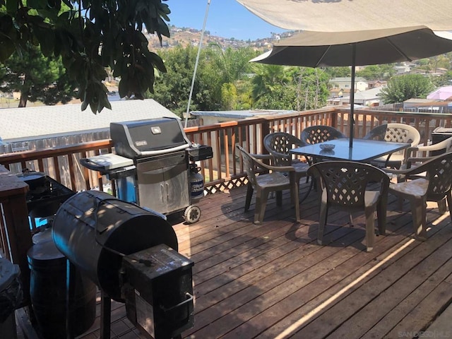 deck featuring a mountain view and grilling area