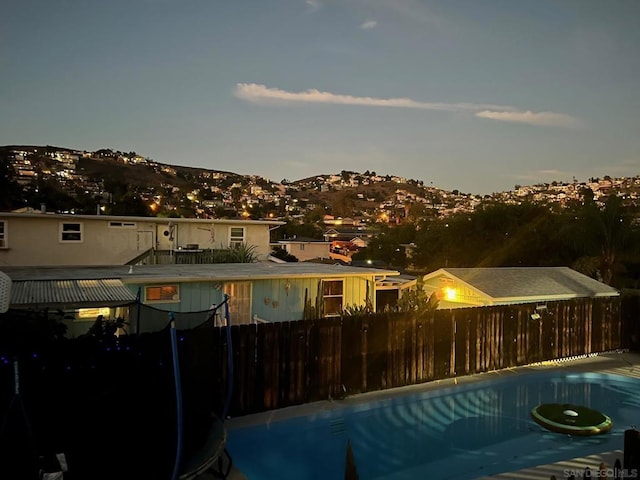 pool at dusk with a mountain view