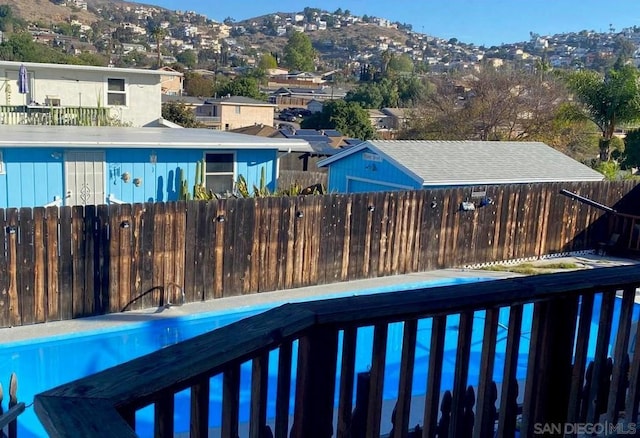 view of swimming pool featuring a mountain view