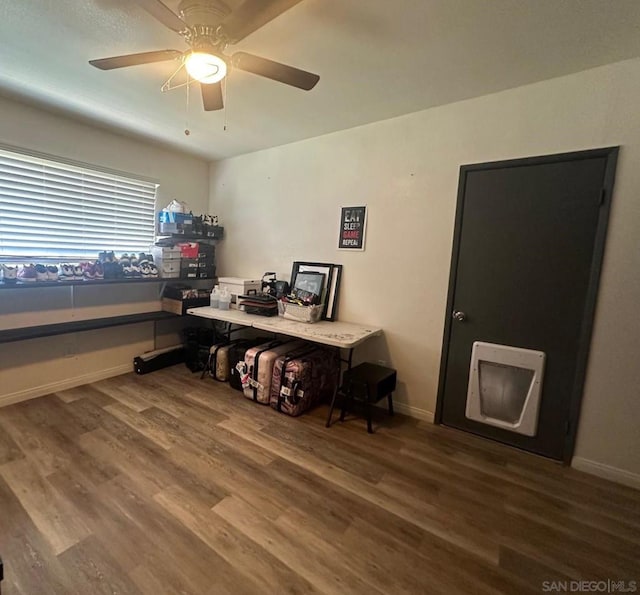 office with hardwood / wood-style floors and ceiling fan