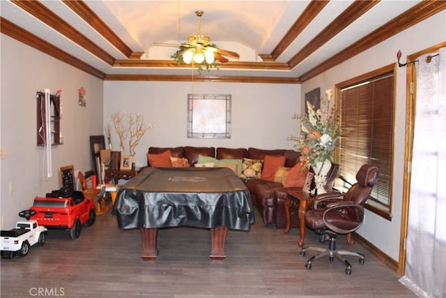 playroom featuring vaulted ceiling, ornamental molding, a tray ceiling, ceiling fan, and hardwood / wood-style floors