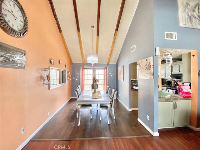 dining room with high vaulted ceiling, dark wood-type flooring, an inviting chandelier, and french doors