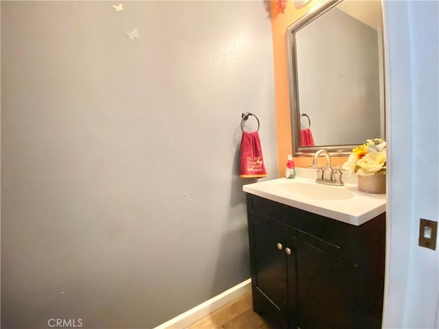 bathroom with vanity and baseboards