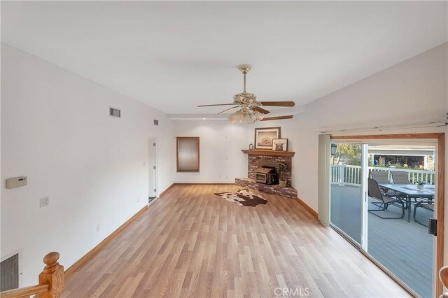 31750 1st St, Acton, CA 93510 - living area with a fireplace, light wood-type flooring, visible vents, and ceiling fan