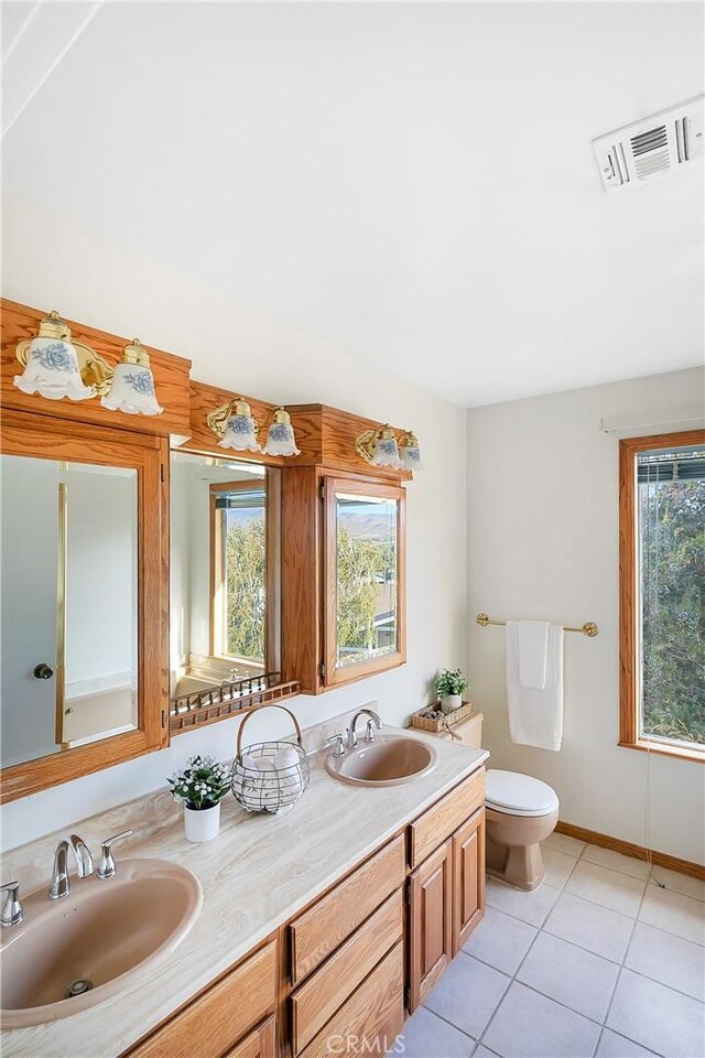 31750 1st St, Acton, CA 93510 - bathroom featuring tile patterned floors, a sink, visible vents, and double vanity