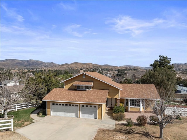 31750 1st St, Acton, CA 93510 - view of front of home with roof with shingles, a mountain view, fence, concrete driveway, and a garage