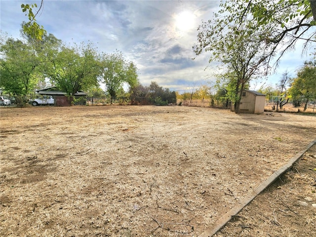 view of yard with a rural view