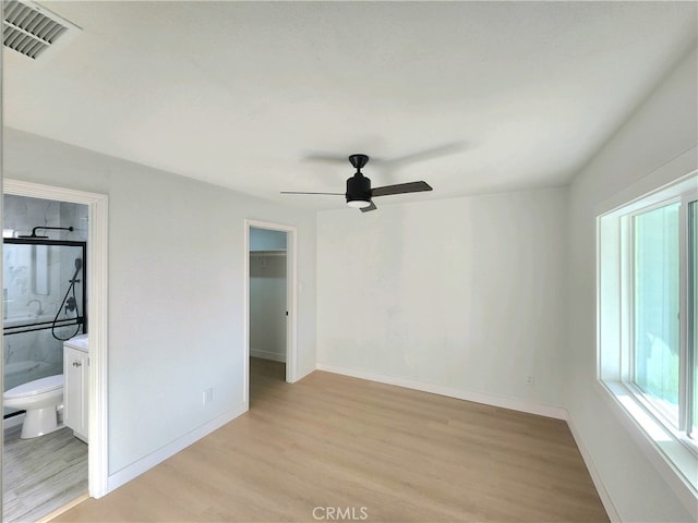 empty room featuring light hardwood / wood-style floors and ceiling fan