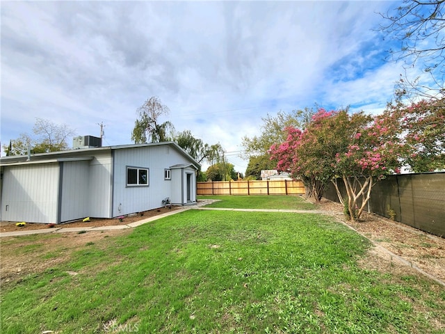 view of yard featuring central AC unit