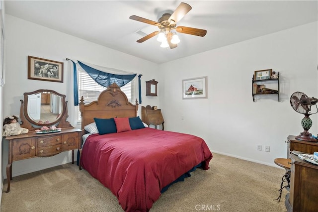 bedroom featuring ceiling fan and light carpet