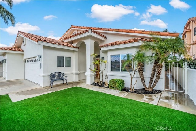 view of front facade with a garage and a front yard