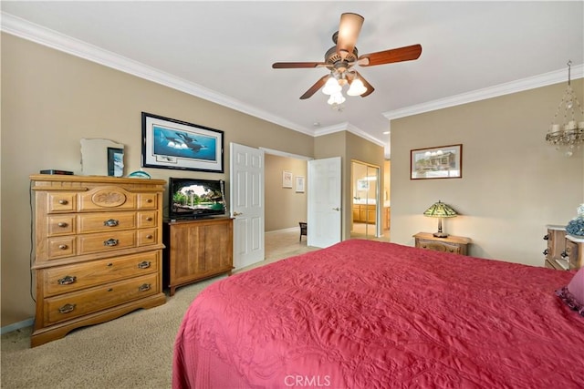 bedroom featuring ornamental molding, light colored carpet, ceiling fan, and ensuite bath