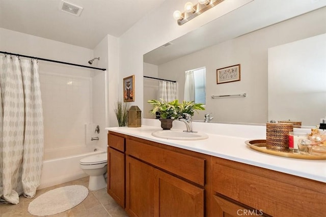 full bathroom with shower / tub combo, vanity, tile patterned flooring, and toilet