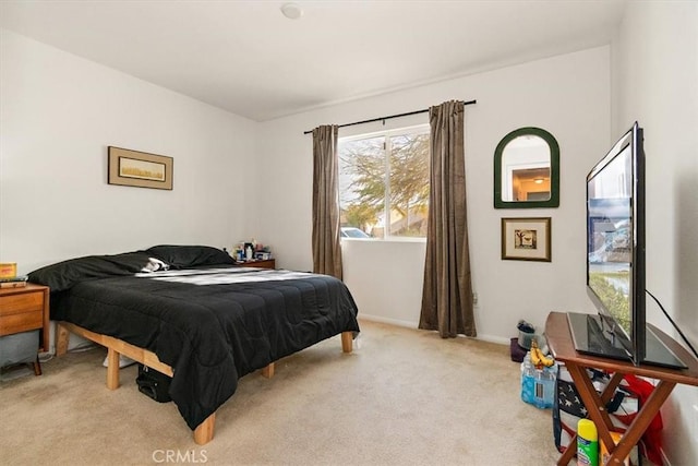 bedroom with light colored carpet