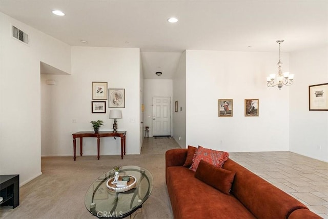 living room with light carpet and a notable chandelier