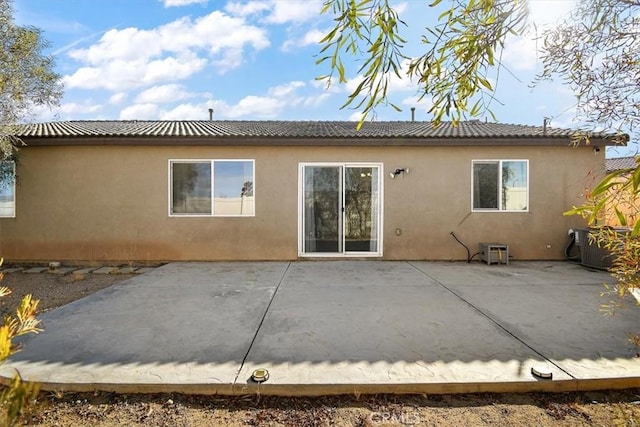 back of property featuring a patio area and central air condition unit