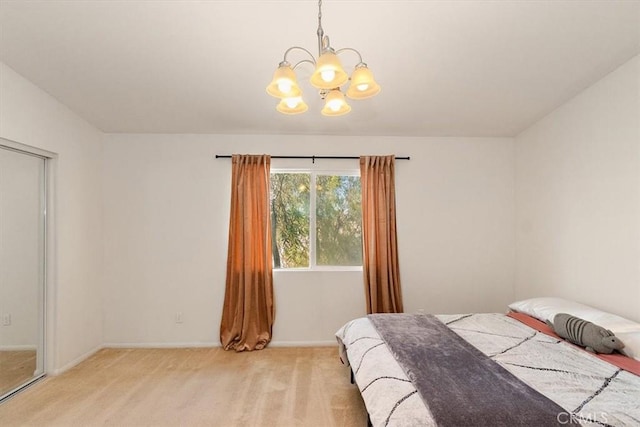 bedroom featuring light colored carpet and a notable chandelier