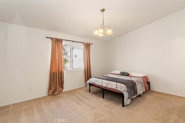 bedroom featuring light colored carpet and a notable chandelier