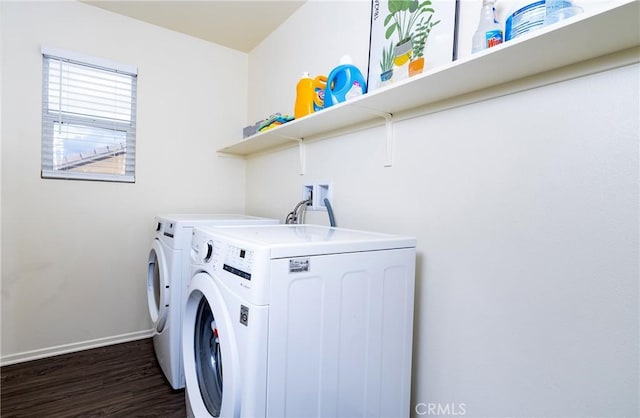 laundry room with dark hardwood / wood-style flooring and washer and clothes dryer