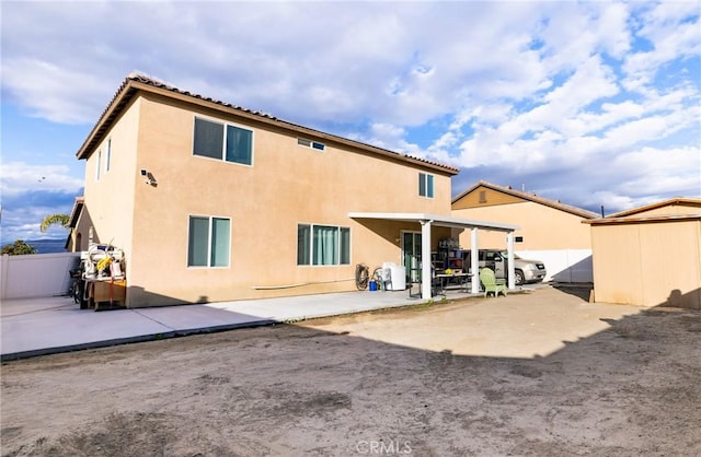 back of property featuring a patio