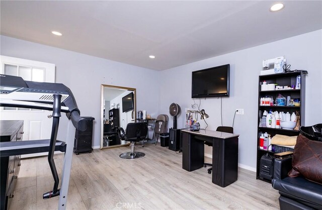 workout room featuring light hardwood / wood-style floors