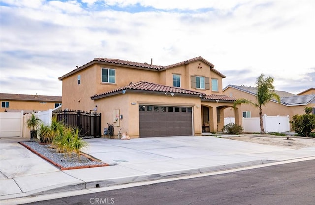 mediterranean / spanish-style home featuring a garage