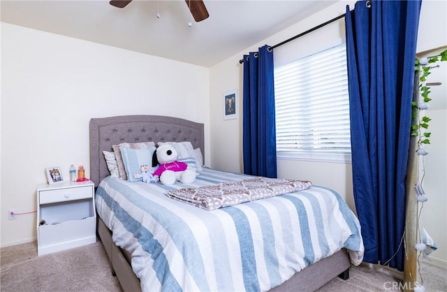 bedroom featuring ceiling fan and light colored carpet