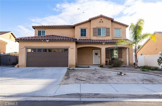 mediterranean / spanish-style house featuring a garage