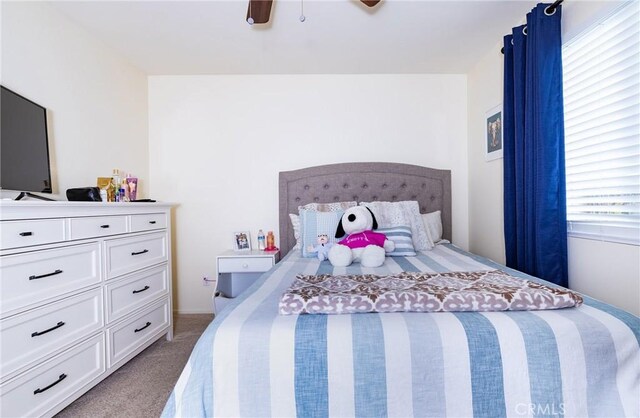 carpeted bedroom with ceiling fan