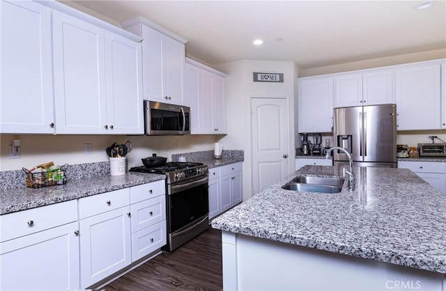 kitchen featuring white cabinetry, appliances with stainless steel finishes, and sink