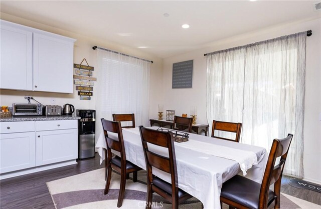 dining area featuring dark hardwood / wood-style floors