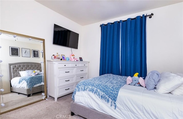 bedroom featuring light colored carpet