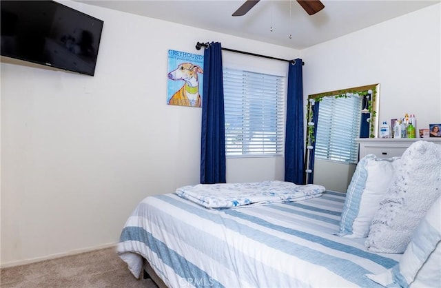 bedroom with ceiling fan and carpet floors