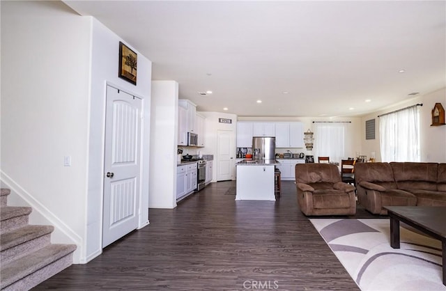 living room with dark wood-type flooring