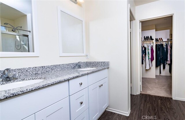 bathroom featuring vanity and hardwood / wood-style flooring