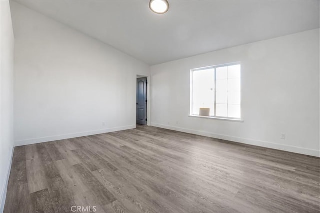 unfurnished room featuring wood-type flooring