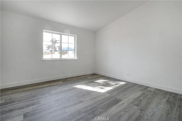 empty room featuring dark hardwood / wood-style floors