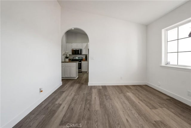 unfurnished room with hardwood / wood-style floors