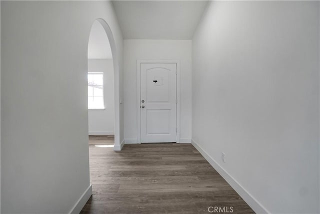 hall with dark hardwood / wood-style floors