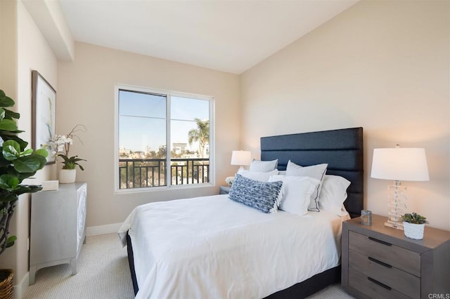 carpeted bedroom with vaulted ceiling